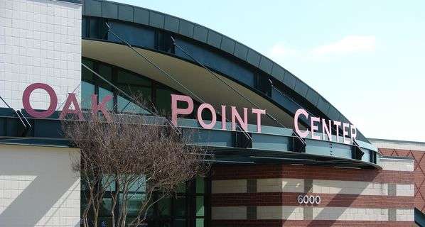 Image of Oak Point Center building with curved roof.